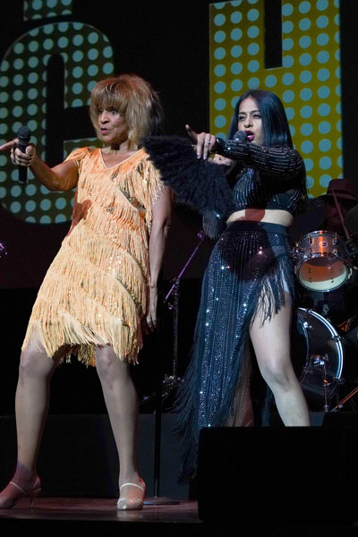 Tina Turner (Pat Hill) and Cher (Dr. Sunnita Tummala) performing Proud Mary