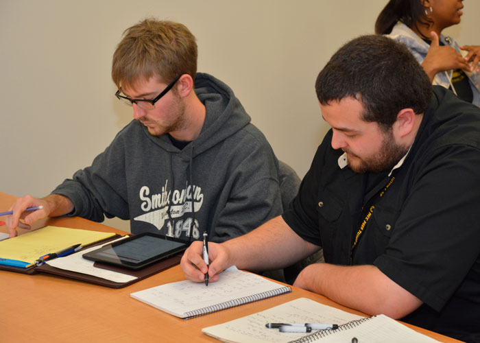 students taking notes in class