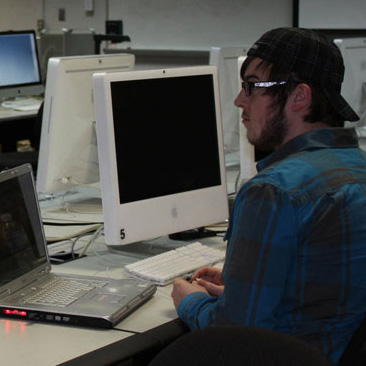 student sitting at a computer