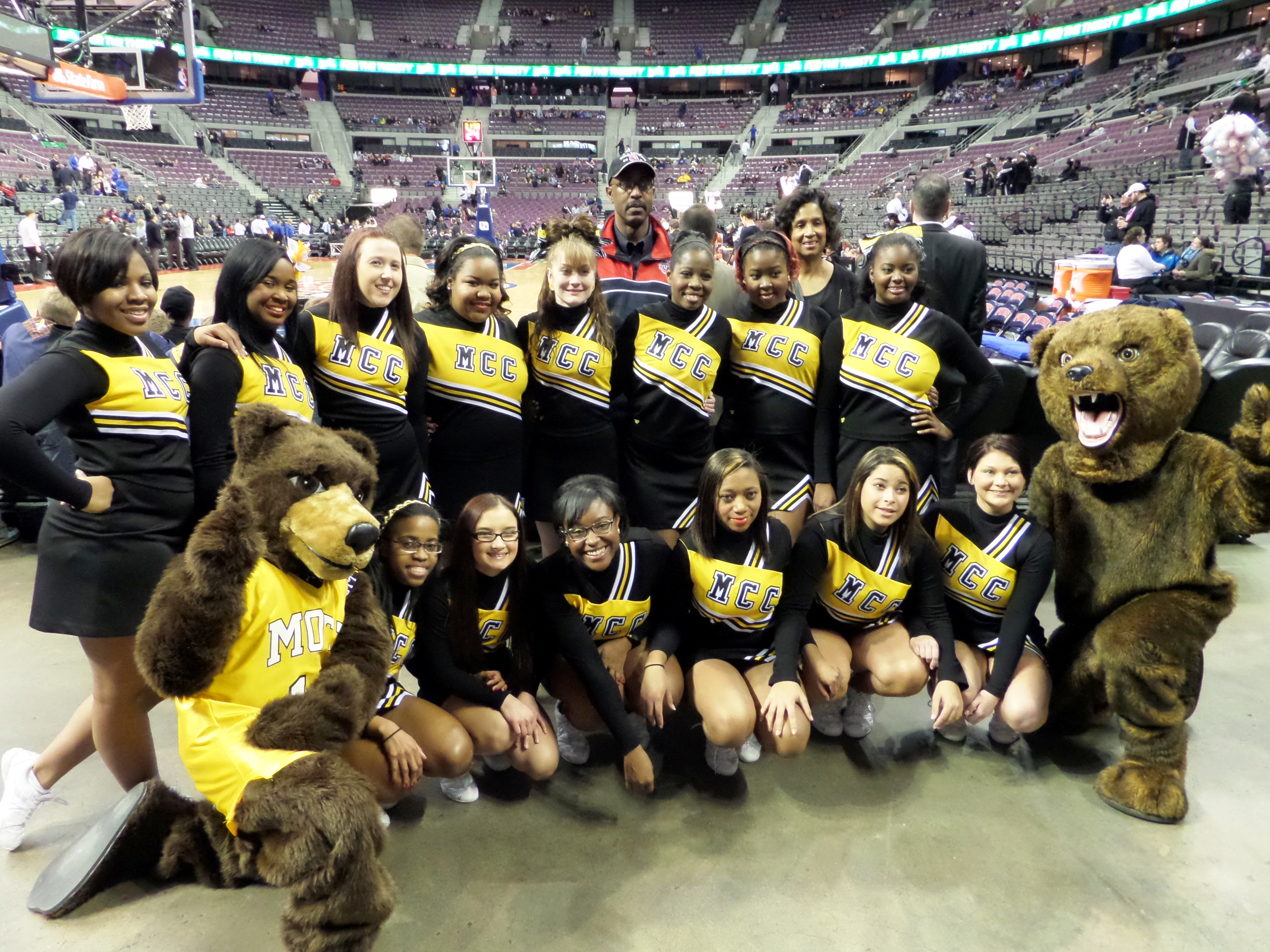 Pictured here are the Mott Cheerleaders with Scott Jenkins, Vice President, Administration and Student Affairs and Lennetta Coney, President of the Foundation for Mott Community College.