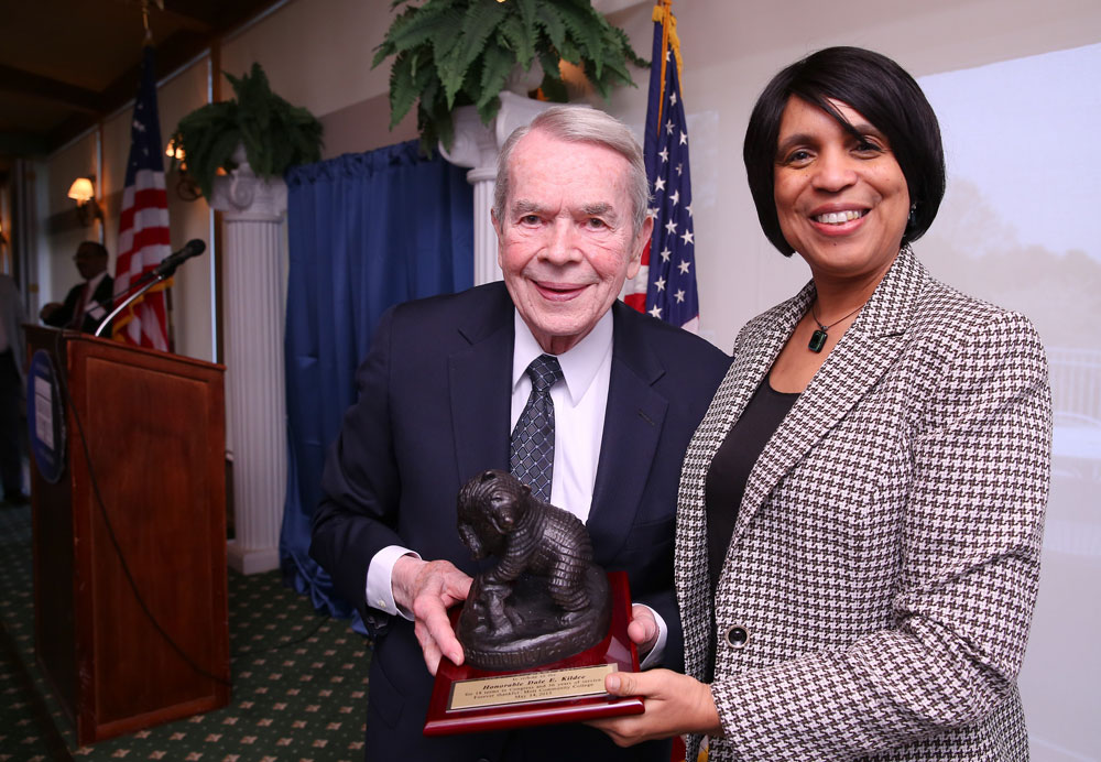 President Dr. Beverly Walker-Griffea presented Mr. Kildee with the MCC Bruin Bear statue.
