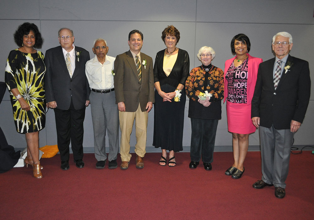 L-R: Lennetta Coney (President of The Foundation for MCC), John Krupp, CPA (President of the MCC Alumni Association and past Distinguished Alumnus), Dr. Rajagopal Shantaram (2015 Outstanding Retiree), Dean Yeotis (2015 Distinguished Alumnus), Dr. Sue Goering (2015 Distinguished Alumnus), Dr. Jane Bingham (2015 Distinguished Alumnus), Dr. Beverly Walker-Griffea (MCC President), and Dr. Ronald Sutliff (2015 Distinguished Alumnus).