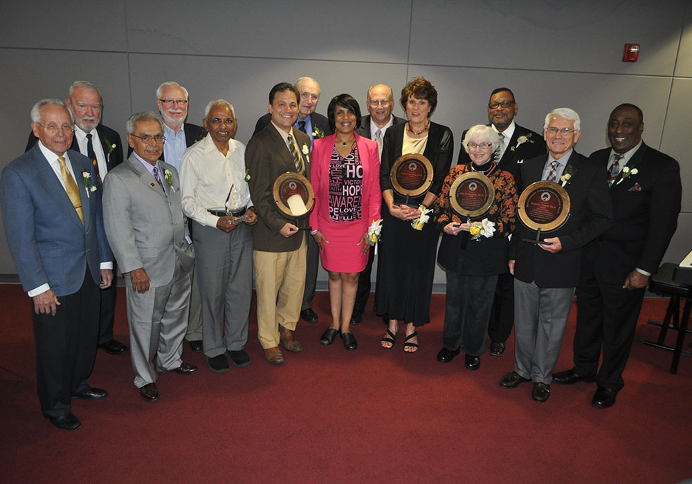 L-R: Past Distinguished Alumni Dr. Richard Shick, Dan Cady, Sixto Olivo and the Honorable Robert Ransom, Dr. Rajagopal Shantaram (2015 Outstanding Retiree), Dean Yeotis (2015 Distinguished Alumnus), the Honorable Thomas Yeotis (past Distinguished Alumnus), Dr. Beverly Walker-Griffea (MCC President), John Krupp, CPA (President of the MCC Alumni Association and past Distinguished Alumnus), Dr. Sue Goering (2015 Distinguished Alumnus), Dr. Jane Bingham (2015 Distinguished Alumnus), Greg Gaines (past Distinguished Alumnus), Dr. Ronald Sutliff (2015 Distinguished Alumnus), and Phillip Wise (past Distinguished Alumnus).