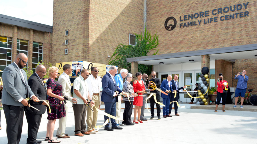 Local and State dignitaries along with MCC members participate in the ribbon cutting for the Lenore Croudy Family Life Center.