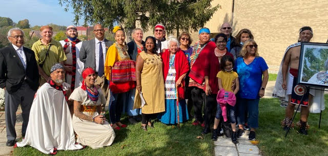 Participants of the celebration with members of the Folded Arms Clan.