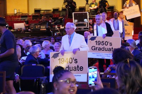 Dr. Richard Schick leading the parade of Alums through the decades. Julius Shaw follows representing the 1950's alums.