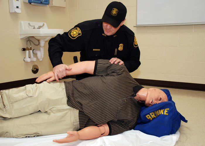 Paramedic practicing on SIM man