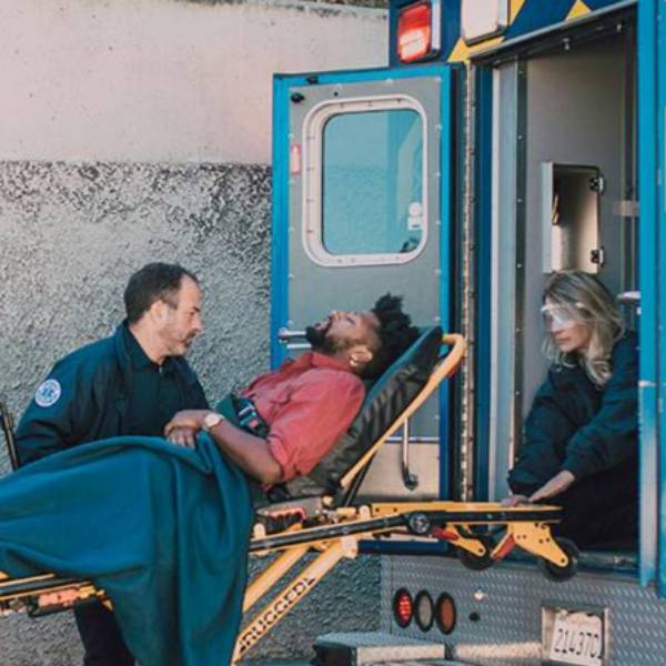 Nursing Students adjusting IV in nursing lab