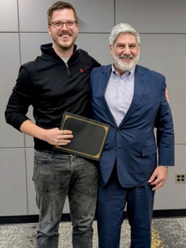 Ross Domke holding award