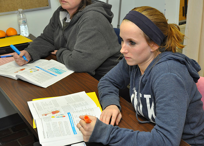 student taking notes