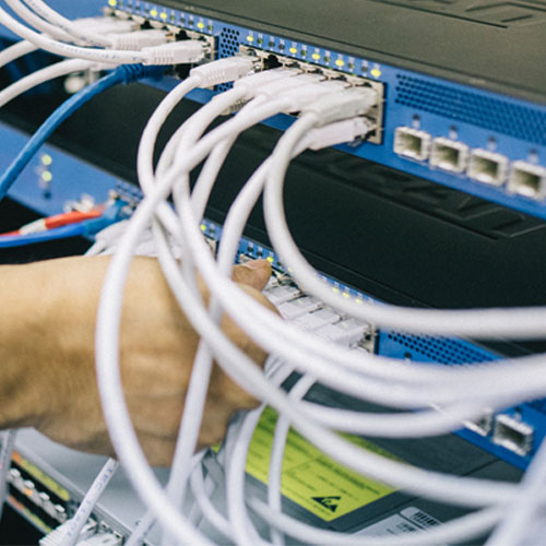 close up of wiring in networking rack