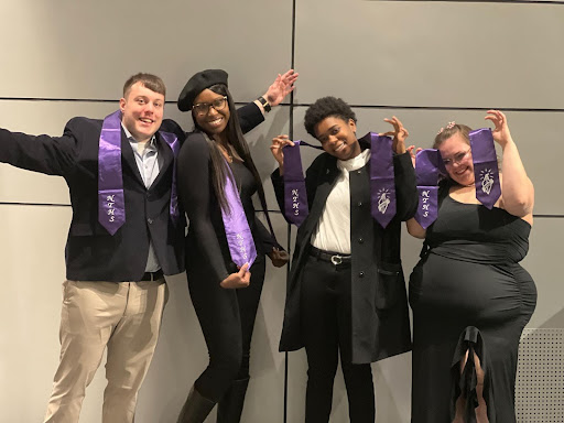 nths student officers in playful poses for the camera