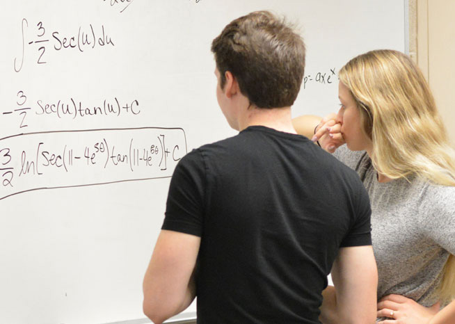 Two student working on advanced math problem