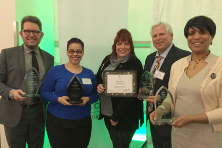 Faculty and Staff presenting service learning awards