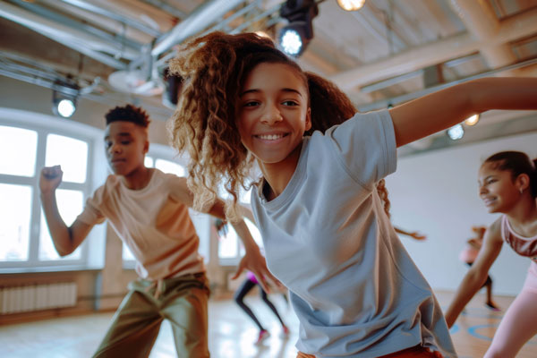 Mixed gender youth performing some type of aerboic exercise in a gym