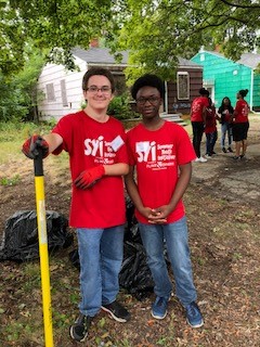 Group of Teens in SYI program doing outdoor clean up project